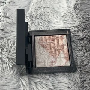 Bobbi Brown highlighter and brush.